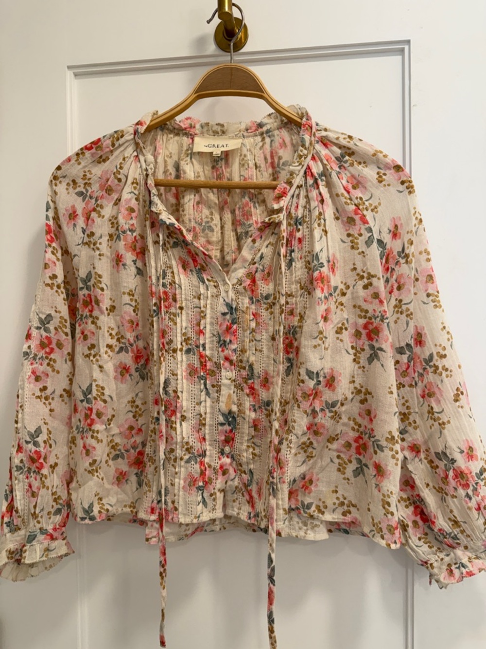 THE GREAT. Cream Floral Pintuck Tie-Neck Blouse